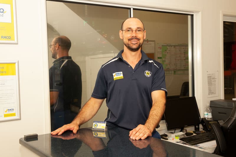 nambour car service mechanic standing behind reception desk