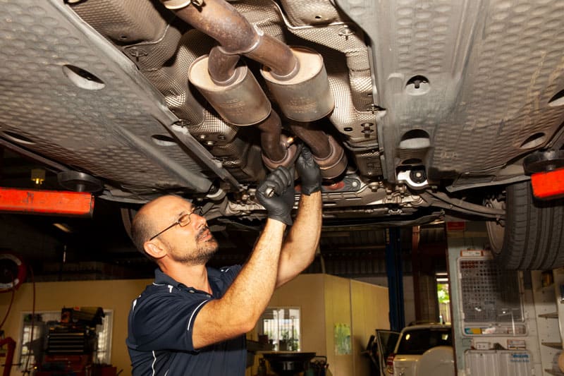 vehicle repair mechanic providing sunshine coast car exhaust repairs underneath vehicle