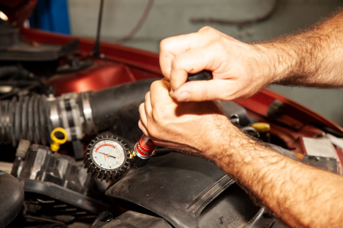 mechanic fixing an engine