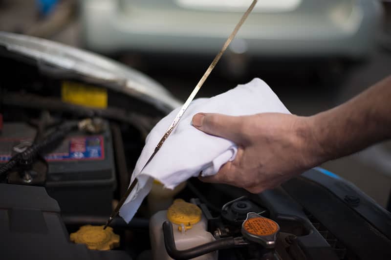 changing oil during roadworthy vehicle inspection service